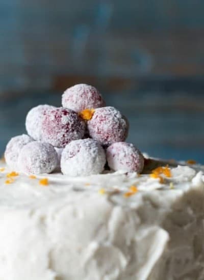 This Orange Spice Cake with Cran-Raspberry Filling and Vanilla Bean Frosting has a combination of flavors that will awaken all of your senses!