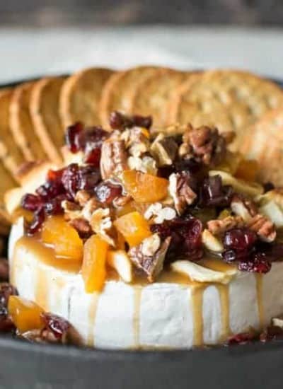 A Spiced Molasses Butterscotch drizzled over a Baked Brie and finished with some dried fruit and nuts. An easy appetizer for your holiday guests!