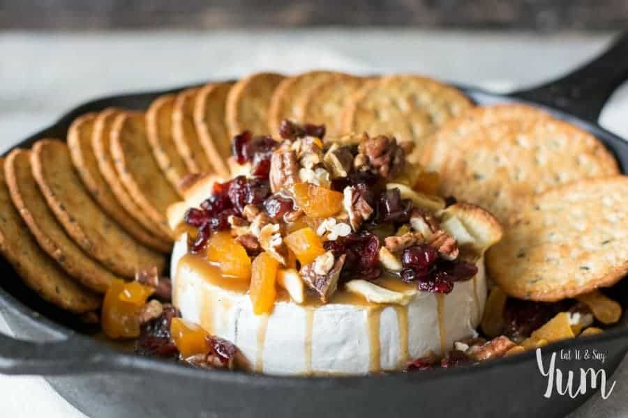 A Spiced Molasses Butterscotch drizzled over a Baked Brie and finished with some dried fruit and nuts. An easy appetizer for your holiday guests!
