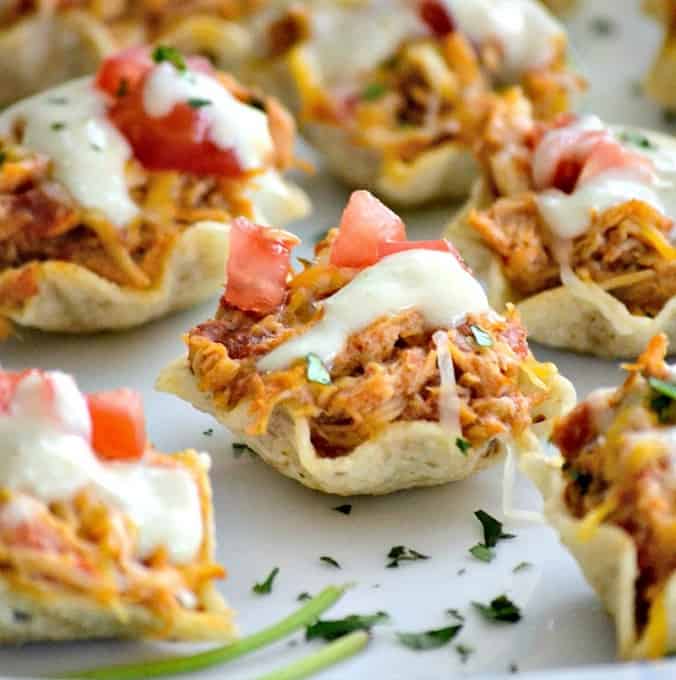 The perfect Game Day appetizer - Chicken Enchilada Bites with a Green Chile Enchilada Cream Sauce!