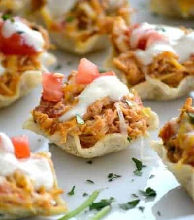 The perfect Game Day appetizer - Chicken Enchilada Bites with a Green Chile Enchilada Cream Sauce!