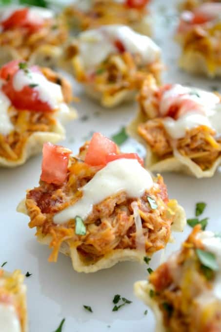 The perfect Game Day appetizer - Chicken Enchilada Bites with a Green Chile Enchilada Cream Sauce!