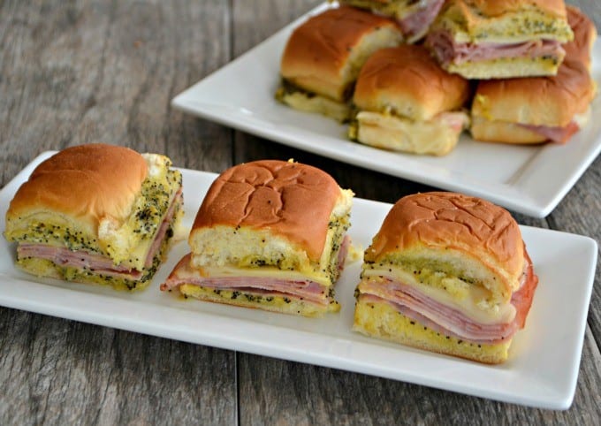 These Ham and Cheese Party Sandwiches on Hawaiian rolls with a poppy seed, mustard spread are perfect for your Game Day entertaining! 