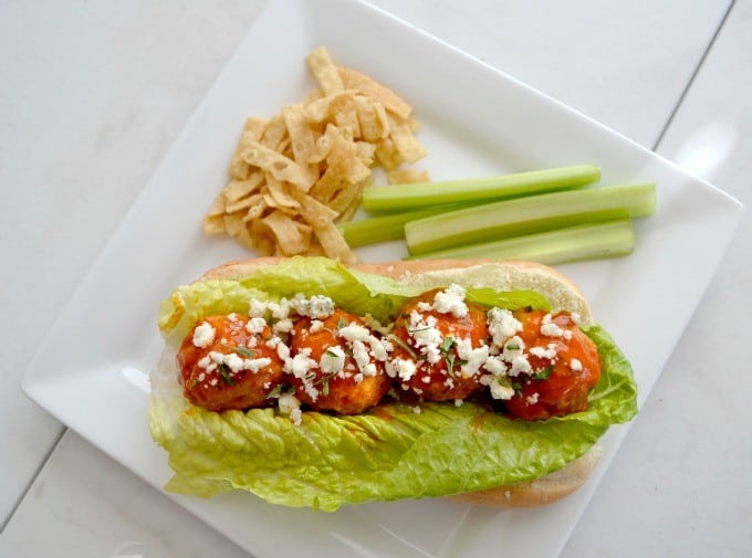 These Buffalo Chicken Meatballs made with ground chicken, buffalo sauce and Panko bread crumbs are perfect as a Game Day appetizer or in a roll topped with your choice of blue cheese or ranch dressing!