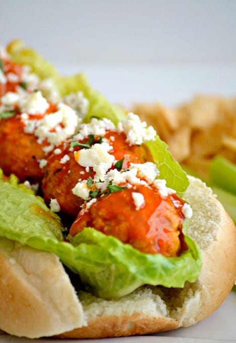 These Buffalo Chicken Meatballs made with ground chicken, buffalo sauce and Panko bread crumbs are perfect as a Game Day appetizer or in a roll topped with your choice of blue cheese or ranch dressing!