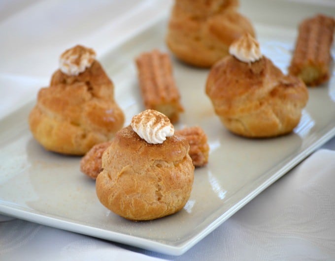 These Churro Cream Puffs are a simple Pâte à Choux filled with a sweetened cinnamon whipped cream and sprinkled with some cinnamon sugar to top it off.