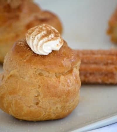 These Churro Cream Puffs are a simple Pâte à Choux filled with a sweetened cinnamon whipped cream and sprinkled with some cinnamon sugar to top them off.