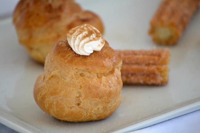 These Churro Cream Puffs are a simple Pâte à Choux filled with a sweetened cinnamon whipped cream and sprinkled with some cinnamon sugar to top them off.
