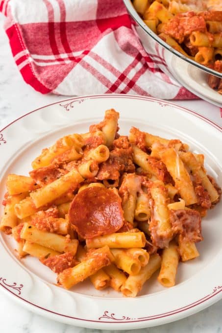 Pasta in a pizza sauce with pepperoni and mozzarella cheese.