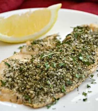 This Steamed Lemon Herb Tilapia is seasoned with fresh lemon, dill, garlic powder and other spices then steamed in the oven in a tin foil packet.