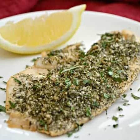 This Steamed Lemon Herb Tilapia is seasoned with fresh lemon, dill, garlic powder and other spices then steamed in the oven in a tin foil packet.