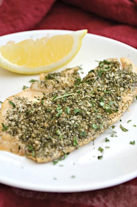 This Steamed Lemon Herb Tilapia is seasoned with fresh lemon, dill, garlic powder and other spices then steamed in the oven in a tin foil packet.