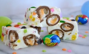 Easter Fudge is white chocolate with mini Cadbury Creme Eggs, and Starburst Jelly Beans - the perfect sweet treat to serve your little bunnies for Easter!