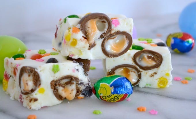 Easter Fudge is white chocolate with mini Cadbury Creme Eggs, and Starburst Jelly Beans - the perfect sweet treat to serve your little bunnies for Easter!