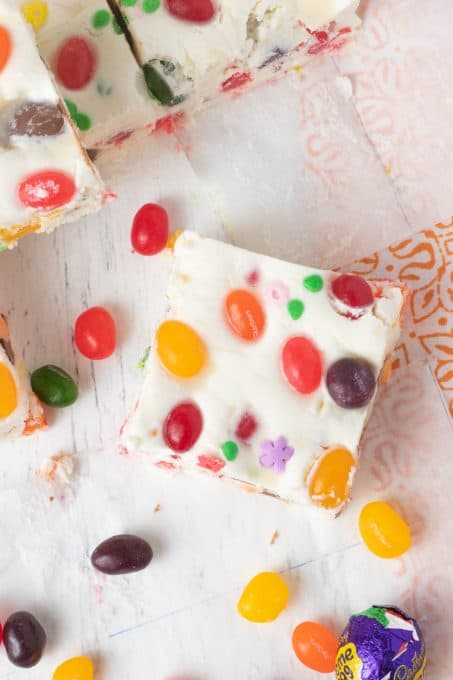 A top view of white fudge with jelly beans.
