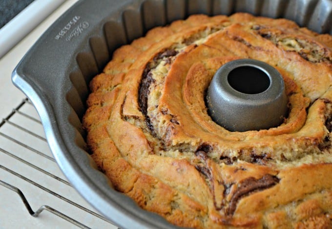 This Nutella Swirl Banana Bundt Bread is Nutella mixed in to a banana bread batter and shaped into a beautiful bundt cake - perfect with a cup of coffee!