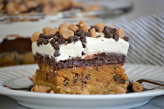 Peanut Butter Cookie Dough Dream Bars topped with mini chocolate and peanut butter chips for a fabulous no bake dessert to wow family and friends!