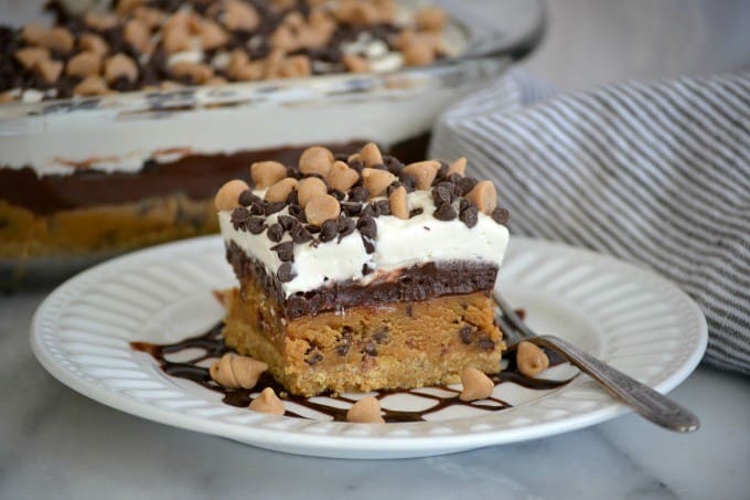 Peanut Butter Cookie Dough Dream Bars topped with mini chocolate and peanut butter chips for a fabulous no bake dessert to wow family and friends!