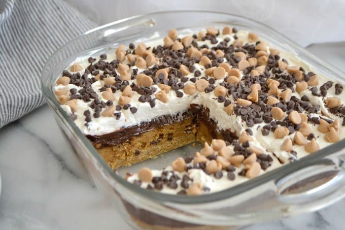 Peanut Butter Cookie Dough Dream Bars topped with mini chocolate and peanut butter chips for a fabulous no bake dessert to wow family and friends!