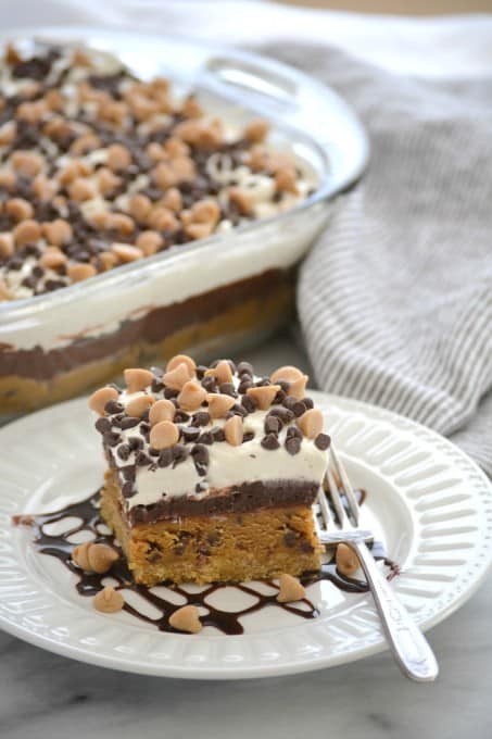 Peanut Butter Cookie Dough Dream Bars topped with mini chocolate and peanut butter chips for a fabulous no bake dessert to wow family and friends!