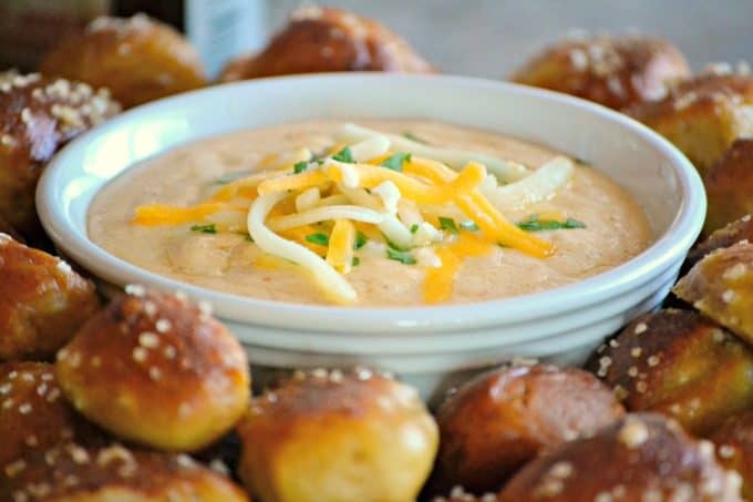 This Beer Cheese Dip and Homemade Pretzel Bites is a smooth, slightly spicy cheese dip with a touch of your favorite brew that goes perfectly with the easy homemade pretzel bites.