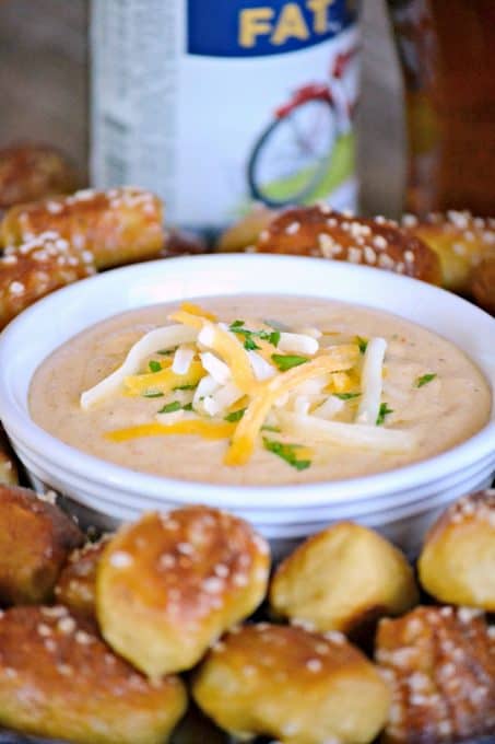 This Beer Cheese Dip and Homemade Pretzel Bites is a smooth, slightly spicy cheese dip with a touch of your favorite brew that goes perfectly with the easy homemade pretzel bites.