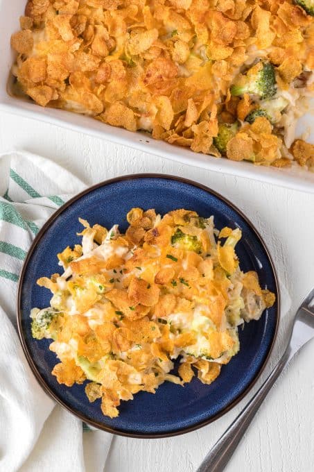 Corn Flakes on top of a chicken casserole with broccoli and rice.
