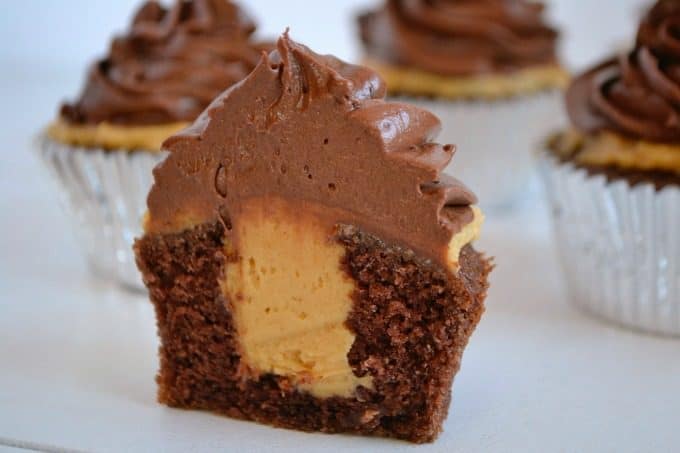 Double Chocolate Peanut Butter Filled Cupcakes - double chocolate cupcakes with a peanut butter cream center topped with chocolate buttercream.