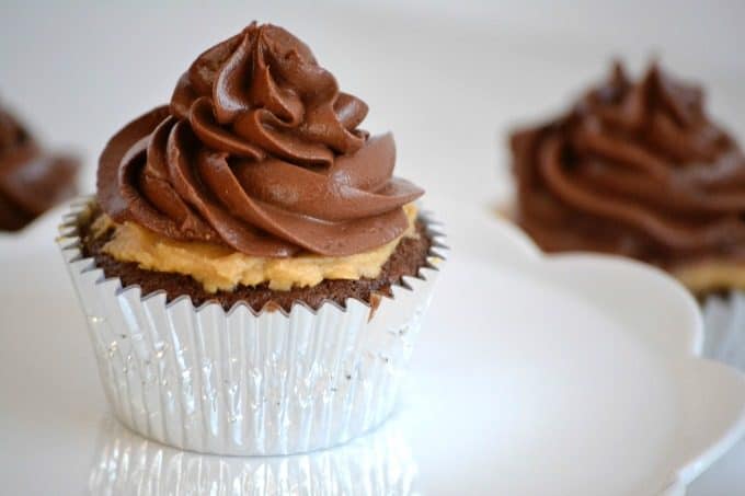 Double Chocolate Peanut Butter Filled CupcakesÂ - double chocolate cupcakes with a peanut butter cream center topped with chocolate buttercream.