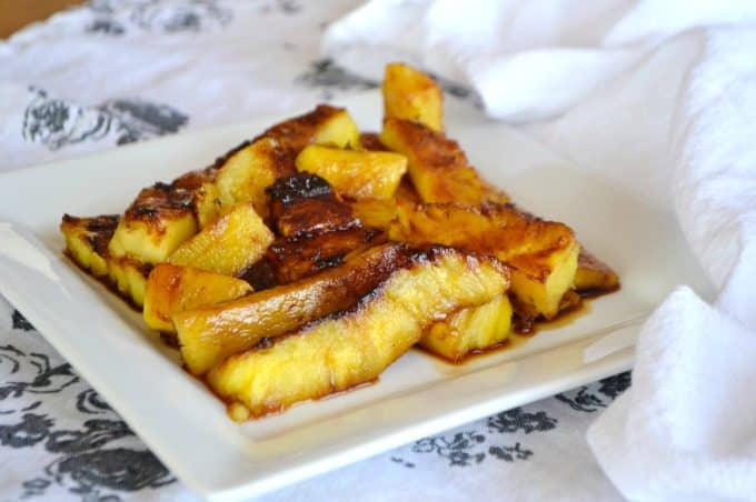This Grilled Pineapple is soaked in rum, coated in brown sugar and grilled. It's perfect as a simple dessert or as a topping over ice cream.