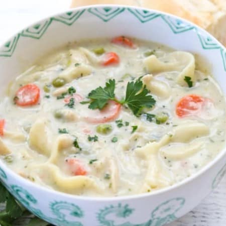 This creamy Homemade Chicken Noodle Soup recipe with chicken, noodles, peas and carrots is a flavorful dish that is super easy to make.