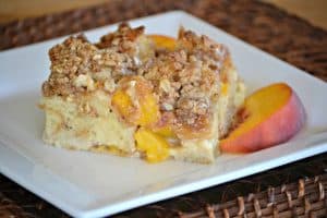 This Peaches and Cream Baked French Toast is made of peaches, cream cheese, French Bread and an egg mixture to make it the perfect seasonal breakfast a favorite everyone's sure to love. 