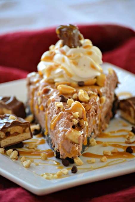 This No Bake Nutella Snickers Pie from Julianne Bayer's cookbook, No Bake Treats: Incredible Unbaked Cheesecakes, Icebox Cakes, Pies and More, is going to be a hit this summer with the delicious creamy Nutella filling, salted caramel and chopped Snickers on top.