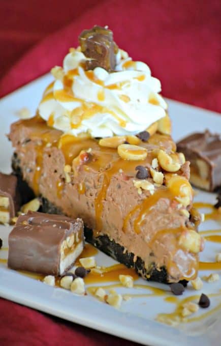 This No Bake Nutella Snickers Pie from Julianne Bayer's cookbook, No Bake Treats: Incredible Unbaked Cheesecakes, Icebox Cakes, Pies and More, is going to be a hit this summer with the delicious creamy Nutella filling, salted caramel and chopped Snickers on top.