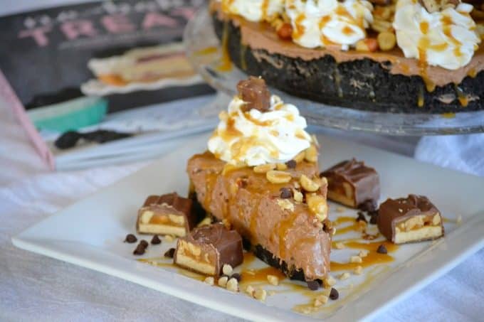 This No Bake Nutella Snickers Pie from Julianne Bayer's cookbook, No Bake Treats: Incredible Unbaked Cheesecakes, Icebox Cakes, Pies and More, is going to be a hit this summer with the delicious creamy Nutella filling, salted caramel and chopped Snickers on top.