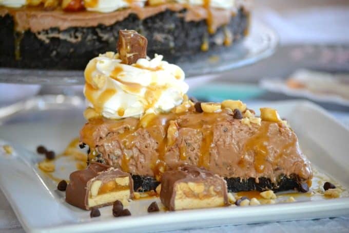 This No Bake Nutella Snickers Pie from Julianne Bayer's cookbook, No Bake Treats: Incredible Unbaked Cheesecakes, Icebox Cakes, Pies and More, is going to be a hit this summer with the delicious creamy Nutella filling, salted caramel and chopped Snickers on top.