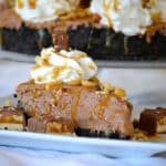 This No Bake Nutella Snickers Pie from Julianne Bayer's cookbook, No Bake Treats: Incredible Unbaked Cheesecakes, Icebox Cakes, Pies and More, is going to be a hit this summer with the delicious creamy Nutella filling, salted caramel and chopped Snickers on top.