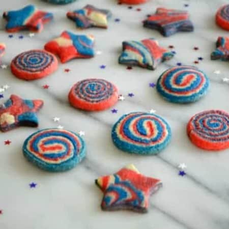 These Patriotic Pinwheel and Star Cookies are made from one sugar cookie dough with three colors to make your Patriotic celebration colorful and festive!