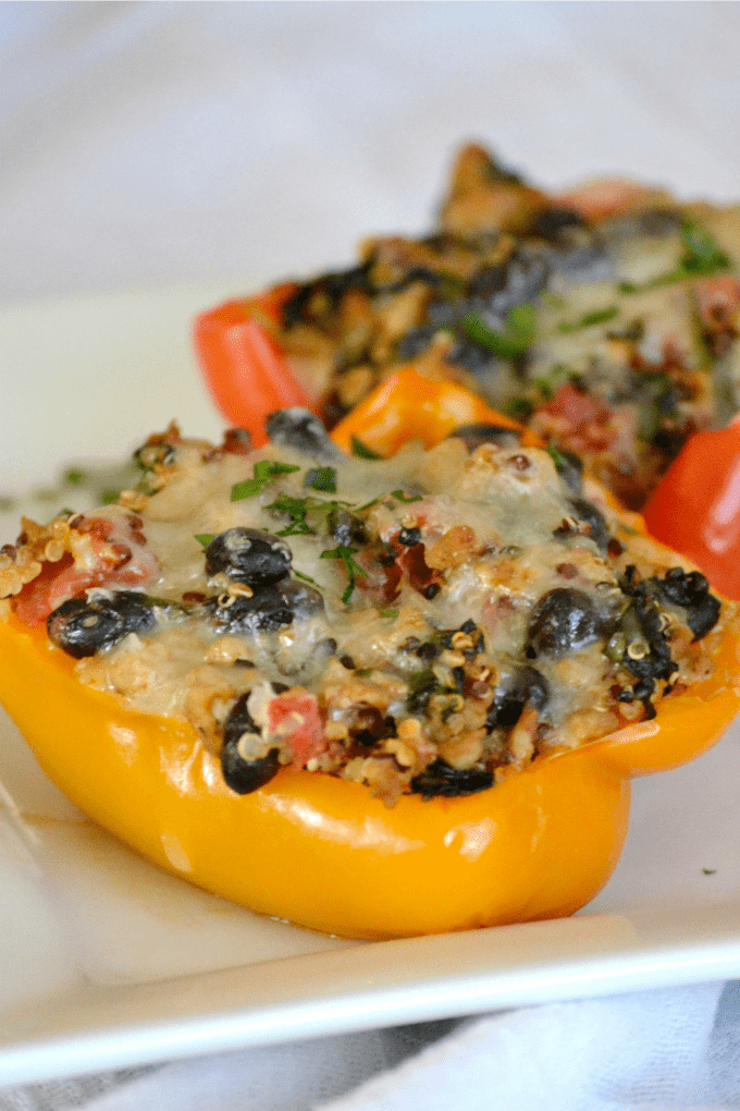 Quinoa, Black Bean and Turkey Stuffed Peppers - colorful bell peppers stuffed with quinoa, black beans and turkey that will satisfy any hungry appetite.