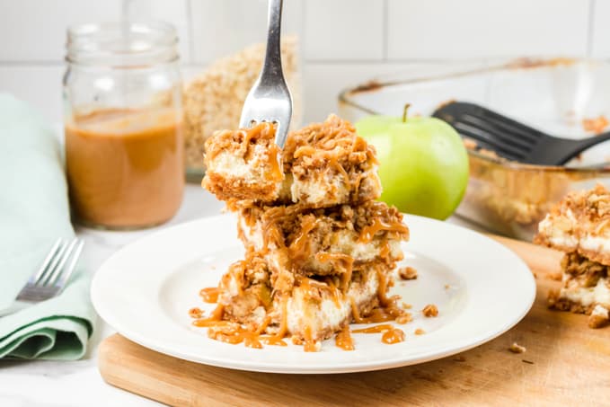 Caramel Apple Cheesecake Bars with a fork.