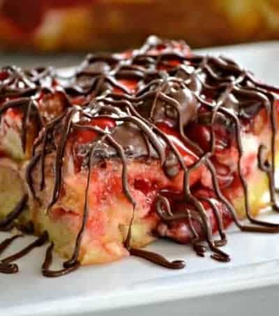 This Chocolate Cherry Cheesecake Bread Pudding with French bread, cream cheese, cherry pie filling and chocolate drizzle make this a memorable dessert!