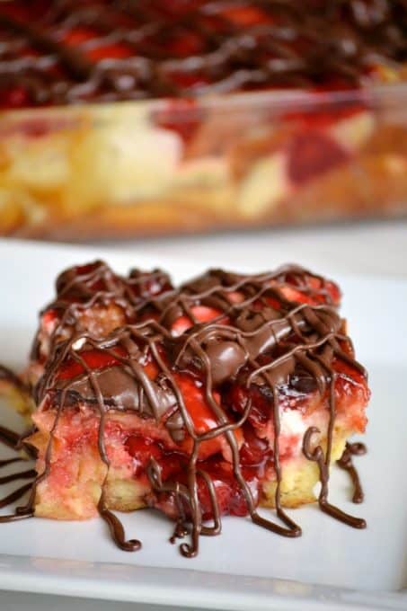 This Chocolate Cherry Cheesecake Bread Pudding with French bread, cream cheese, cherry pie filling and chocolate drizzle make this a memorable dessert!