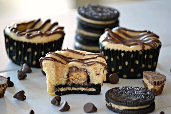 These Mini Peanut Butter Cup Cheesecakes are individually sized peanut butter cheesecakes with a surprise mini Reese's Peanut Butter Cup, drizzled with chocolate. Chocolate and peanut butter lovers will go nuts!