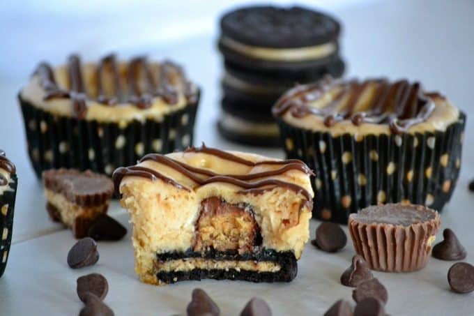 These Mini Peanut Butter Cup Cheesecakes are individually sized peanut butter cheesecakes with a surprise mini Reese's Peanut Butter Cup, drizzled with chocolate. Chocolate and peanut butter lovers will go nuts!
