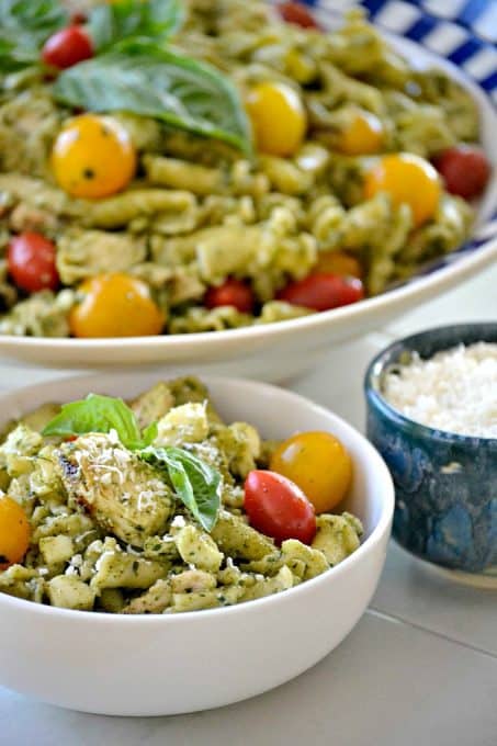 This Pesto Chicken Pasta Salad is pasta, diced chicken, tomatoes and diced mozzarella tossed in an easy pesto. It can also be a side without the chicken!