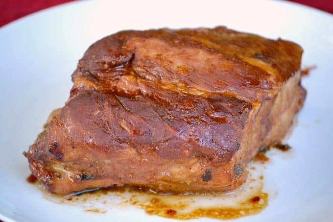 This Slow Cooker Spicy Orange Pork Roast uses the slow cooker to make an easy pork roast with lots of great flavor! Eat it sliced or shred it to use in lettuce wraps.