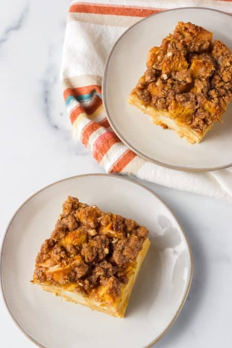 Pieces of Pumpkin baked French Toast on plates.