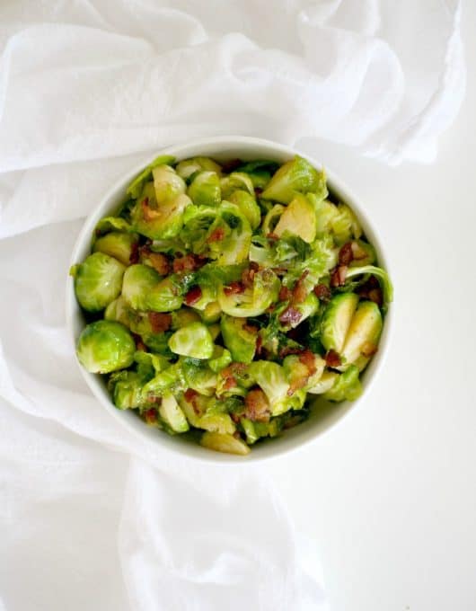 These Maple Bacon Brussels Sprouts are Brussels sprouts cooked in a skillet with bacon, some brown sugar and maple syrup. This is a great side dish to serve with any dinner and will convert your Brussels sprouts hater.