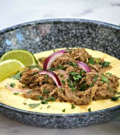 Slow Cooker Beef Chili Verde with Polenta are savory beef short ribs with salsa verde. Serve with polenta and you've got a super easy and delicious dinner.