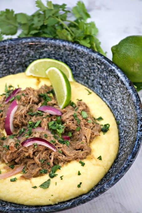 Slow Cooker Beef Chili Verde with Polenta are savory beef short ribs with salsa verde. Serve with polenta and you've got a super easy and delicious dinner.